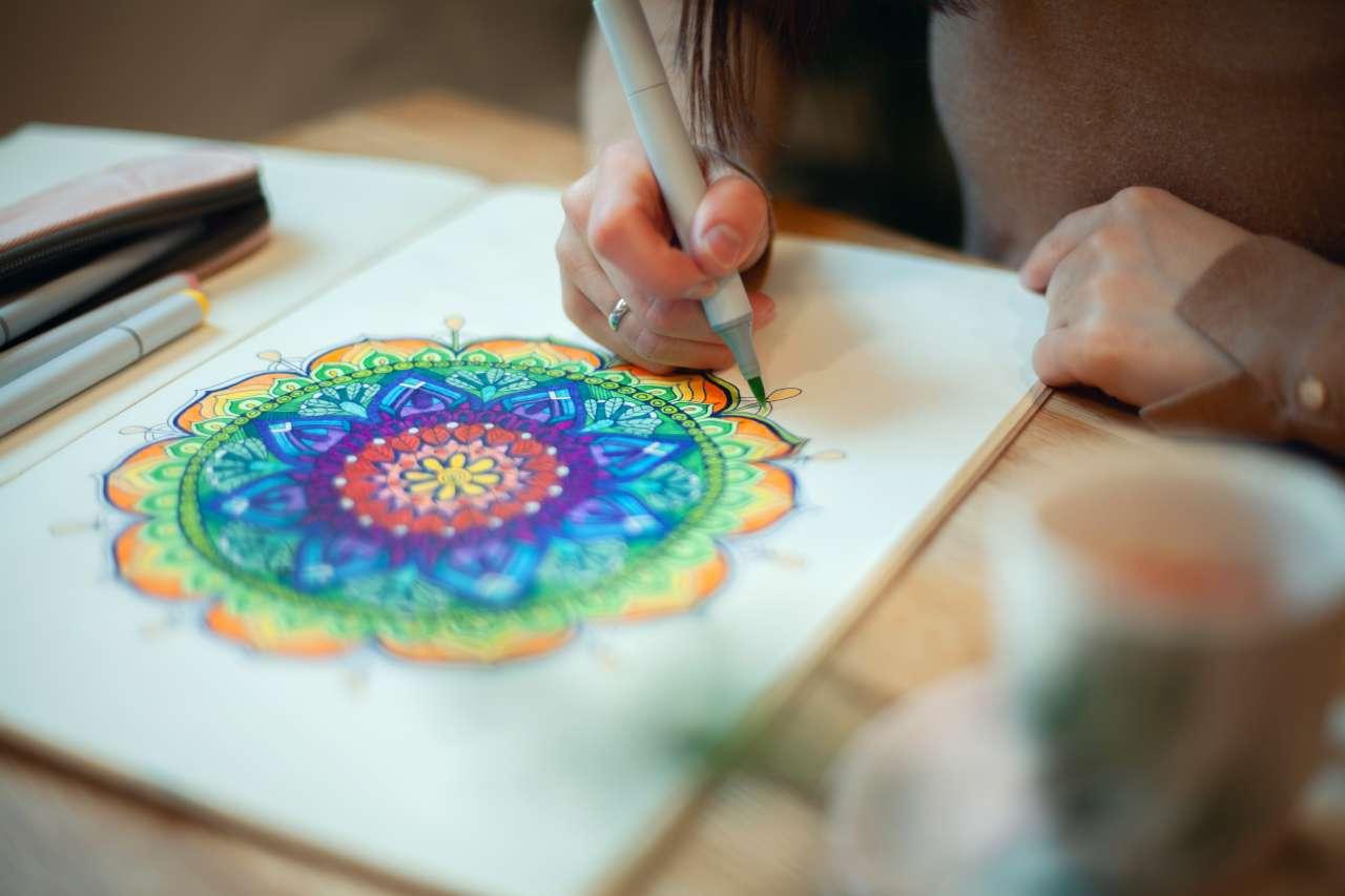 Woman drawing a geometric shape